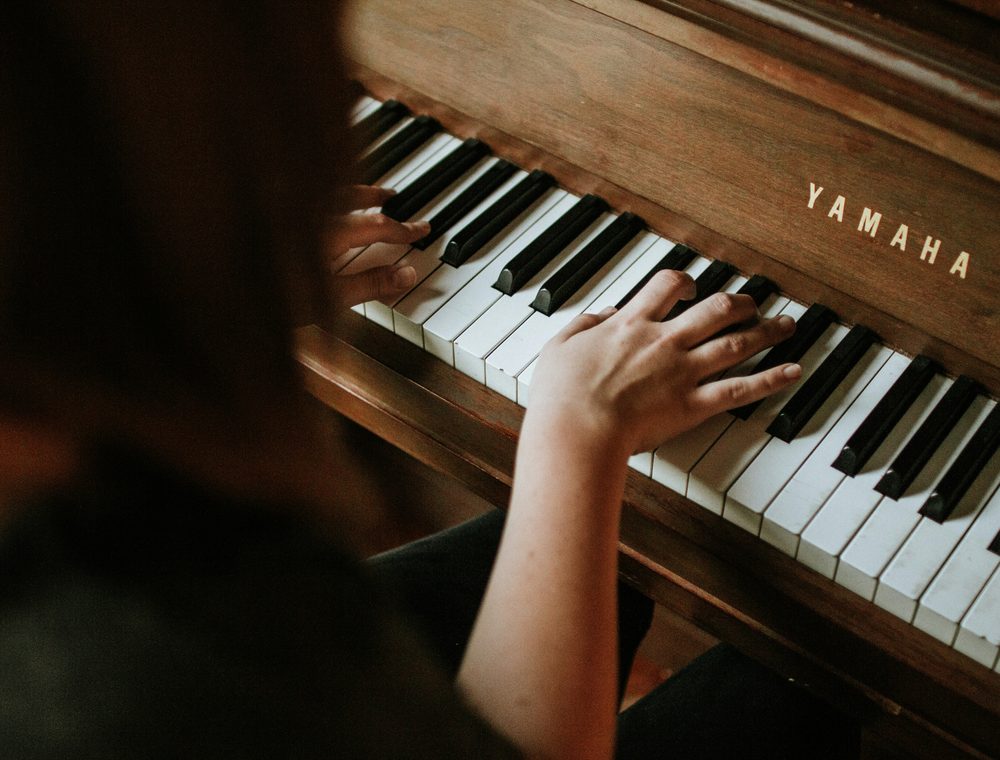 A piano at home in a bright living room