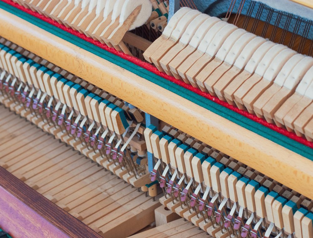 Close view of piano hammers and dampers in the action