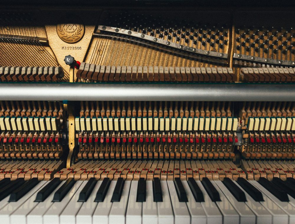 A tuning lever seated on a piano tuning pin